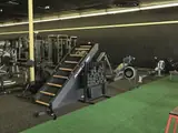 Cardio and strength equipment on the training floor at Bee Fit West Cincinnati